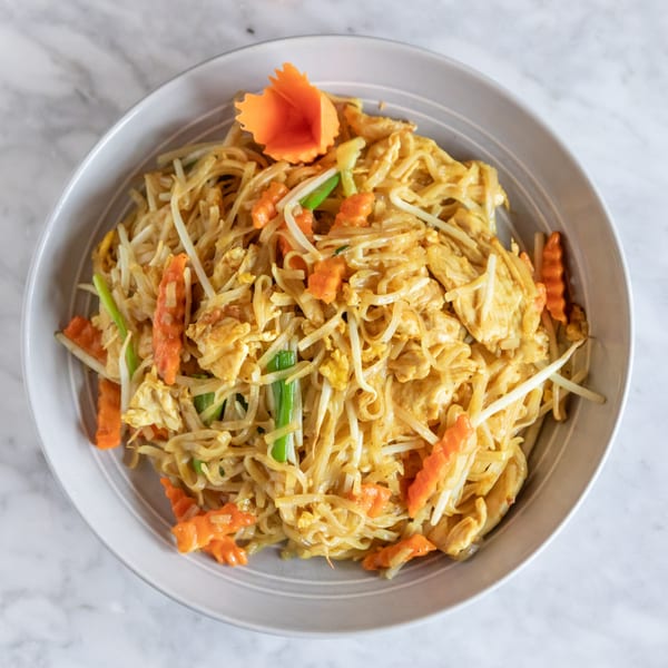 Phattra Thai Restaurant's Pad See Ew with chicken, noodles, bean sprouts, carrots, and green onions.